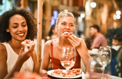 woman eating bruschetta